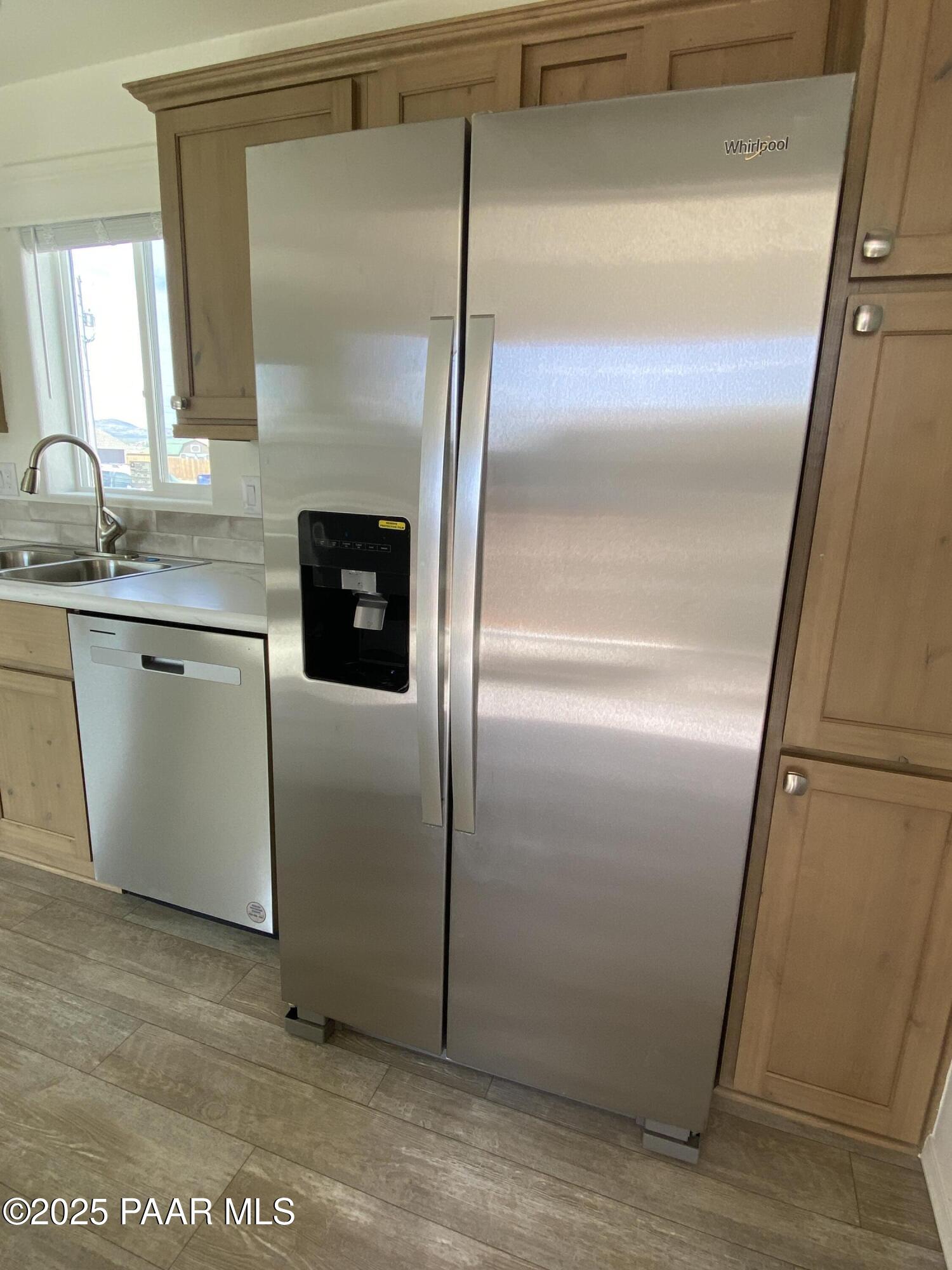 215 West Venice Way Paulden, AZ 86334 - Photo 2 of 40 a kitchen with metallic refrigerator freezer and a granite counter tops