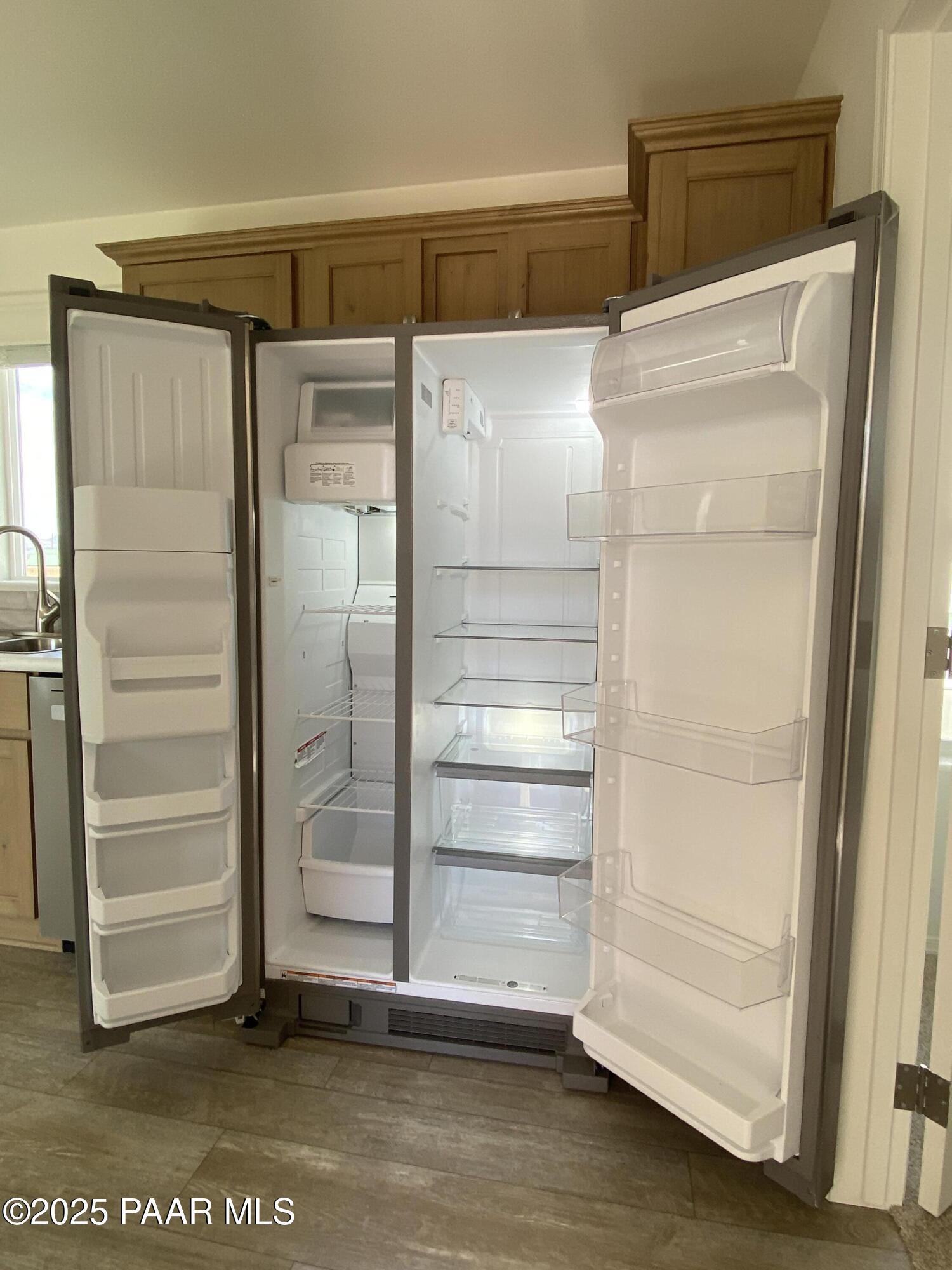 215 West Venice Way Paulden, AZ 86334 - Photo 5 of 40 a refrigerator freezer sitting inside of a room