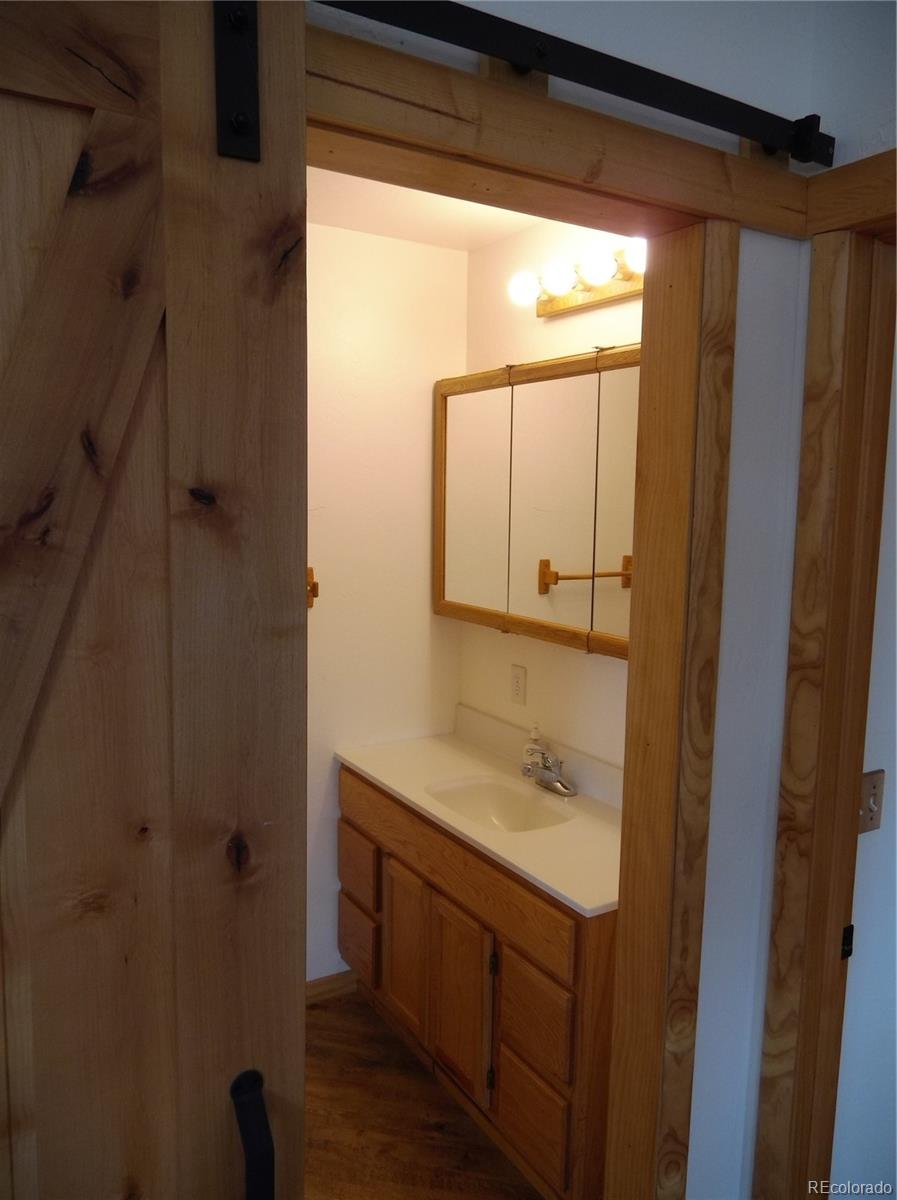 10299 Kingsview Road Austin, CO 81410 - Photo 18 of 40 a bathroom with a shower and a sink