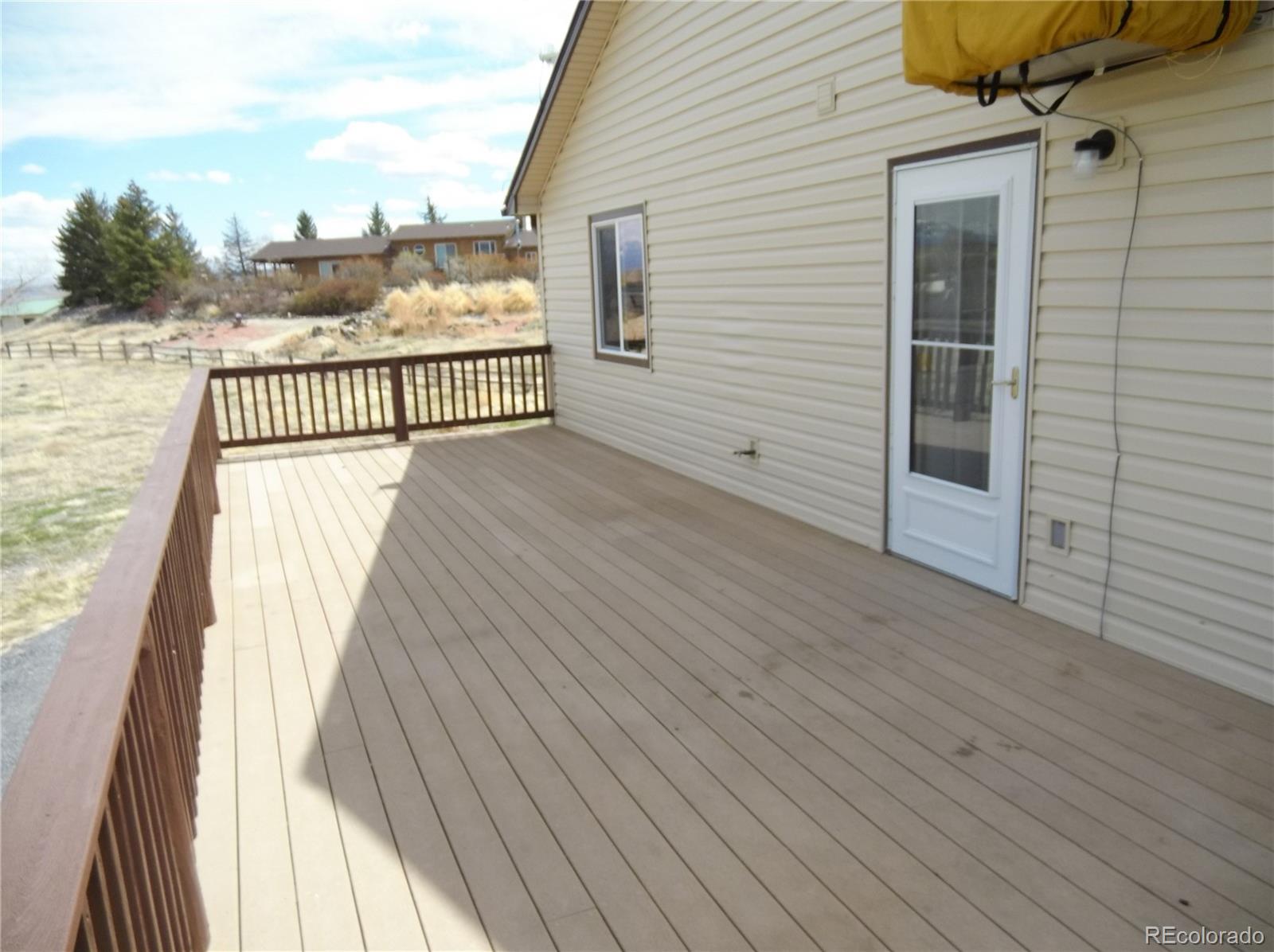 10299 Kingsview Road Austin, CO 81410 - Photo 23 of 40 a view of a balcony with wooden floor