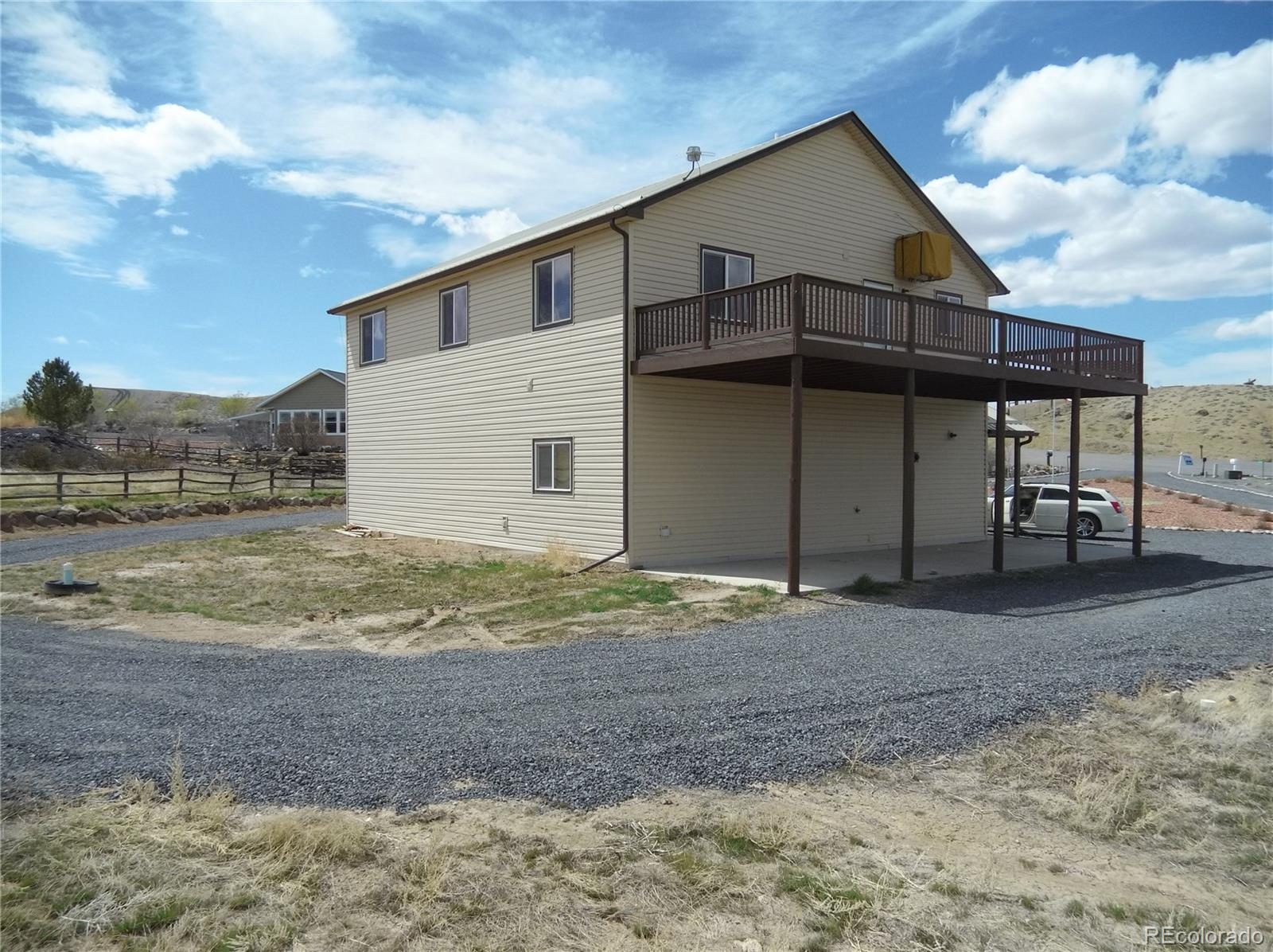 10299 Kingsview Road Austin, CO 81410 - Photo 39 of 40 a view of a house with a backyard