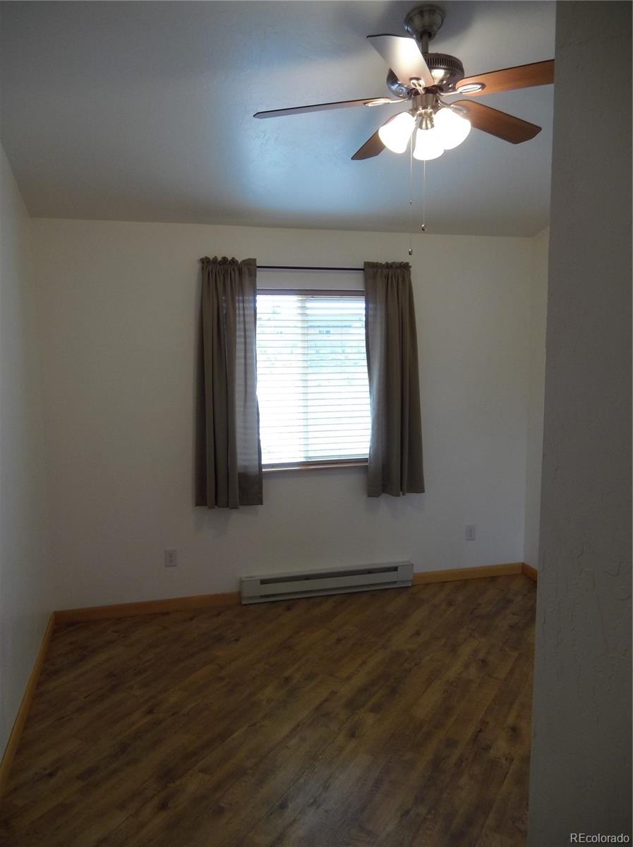 10299 Kingsview Road Austin, CO 81410 - Photo 7 of 40 a view of empty room with window and fan