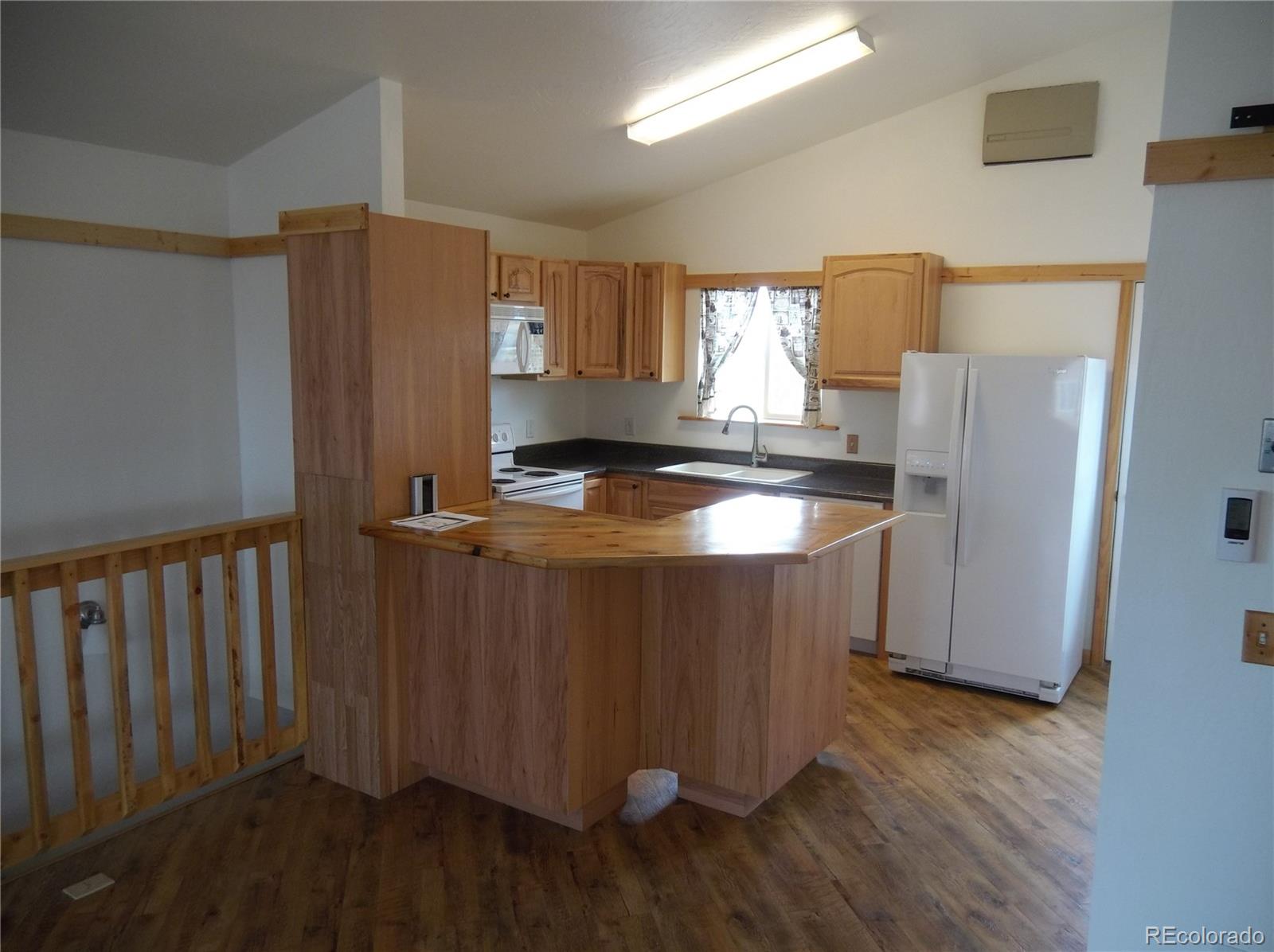 10299 Kingsview Road Austin, CO 81410 - Photo 10 of 40 a kitchen with stainless steel appliances granite countertop a refrigerator a sink and a stove