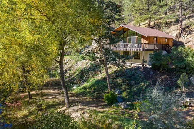 a view of a house with a tree