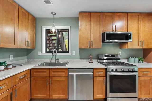 a bathroom with a toilet a sink and a mirror