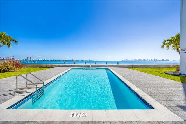 a view of a lake with sitting area