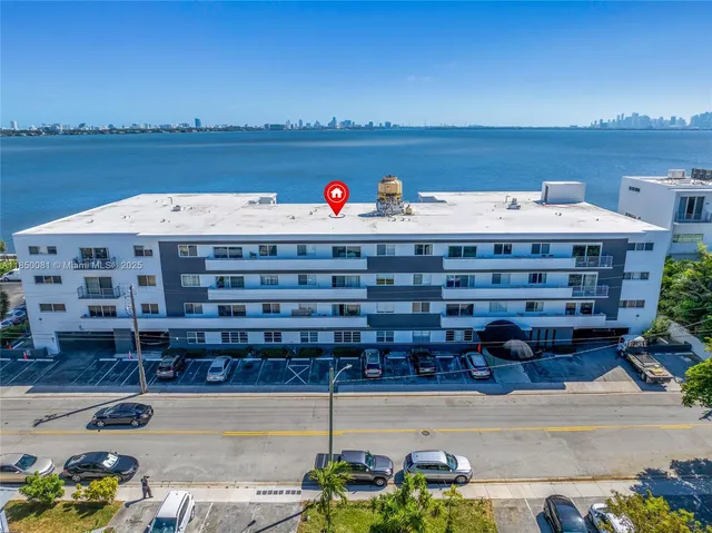 an aerial view of a house with a ocean view