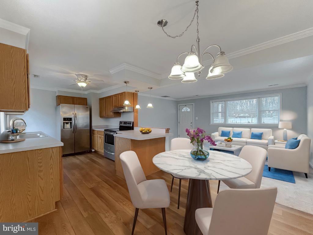 4485 Solomons Island Road Huntingtown, MD 20639 - Photo 2 of 46 a view of a dining room with furniture and window