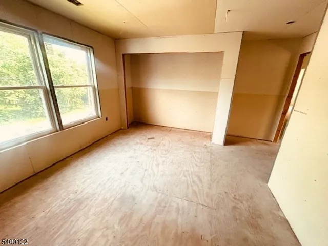 an empty room with a empty space and window