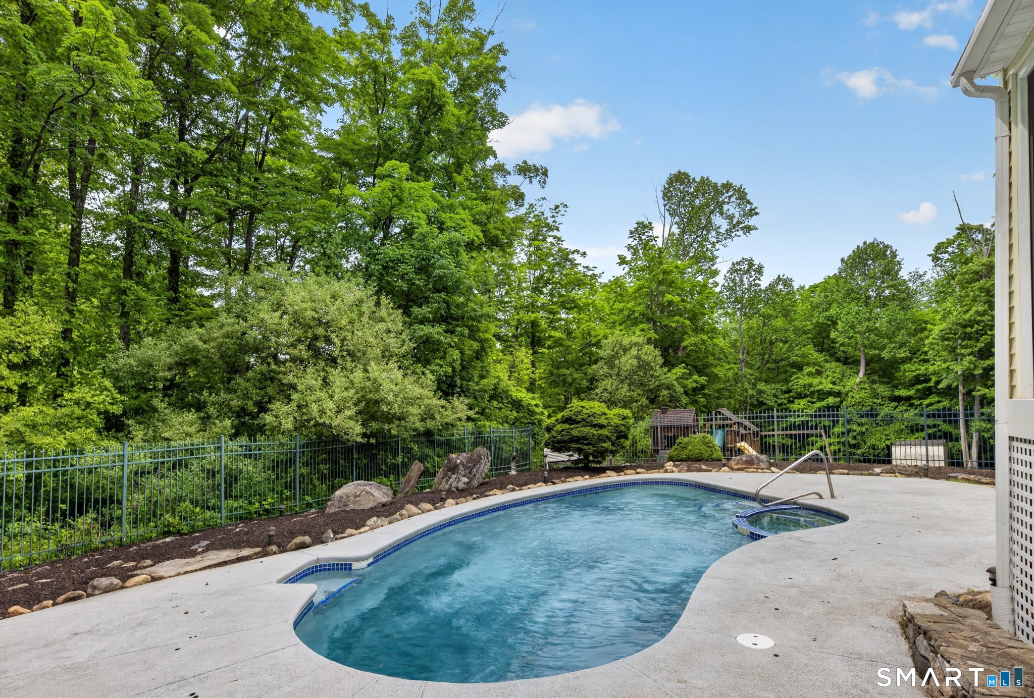 70 Barrack Hill Road Ridgefield, CT 06877 - Photo 26 of 32 a view of a swimming pool in a backyard