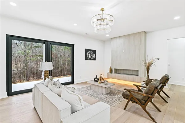 a living room with furniture and a large window
