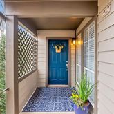 a view of a door and wooden floor