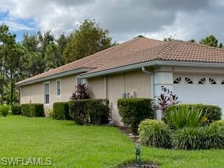 7832 Meridan Court Naples, FL 34104 - Photo 3 of 18 a view of a house with a garden