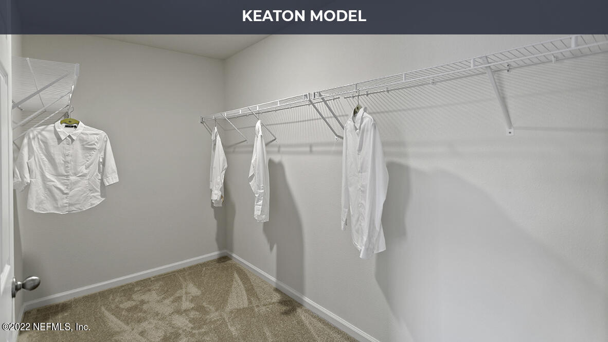63 Java Lane St. Augustine, FL 32092 - Photo 14 of 41 a view of walk in closet with clothes