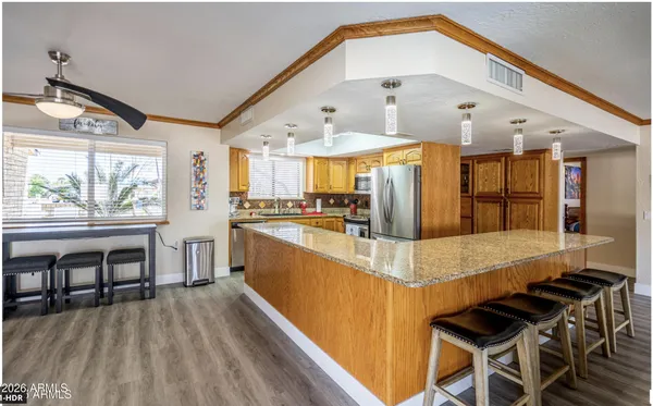 a bed room with a bed and a chandelier