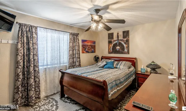 a bathroom with a sink and a mirror with toilet