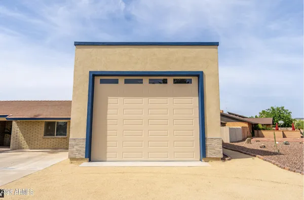 a view of an outdoor sitting area in a backyard