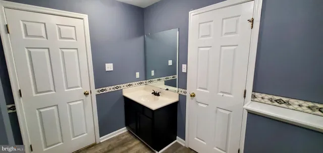 a bathroom with a sink and washing machine