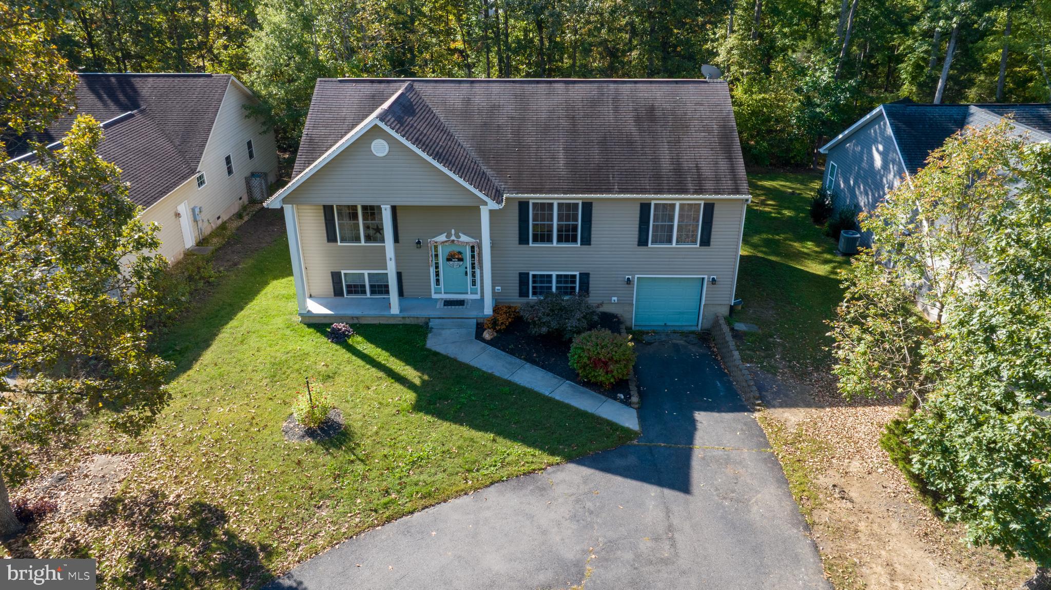 309 Liberty Boulevard Locust Grove, VA 22508 - Photo 31 of 42 a aerial view of a house with a yard table and chairs