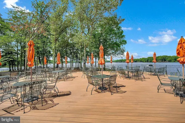 a view of a lake with outdoor seating space