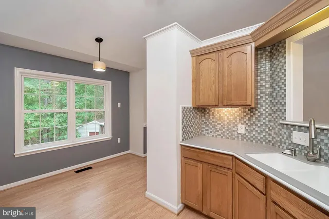 a view of a kitchen with a sink cabinets and a window