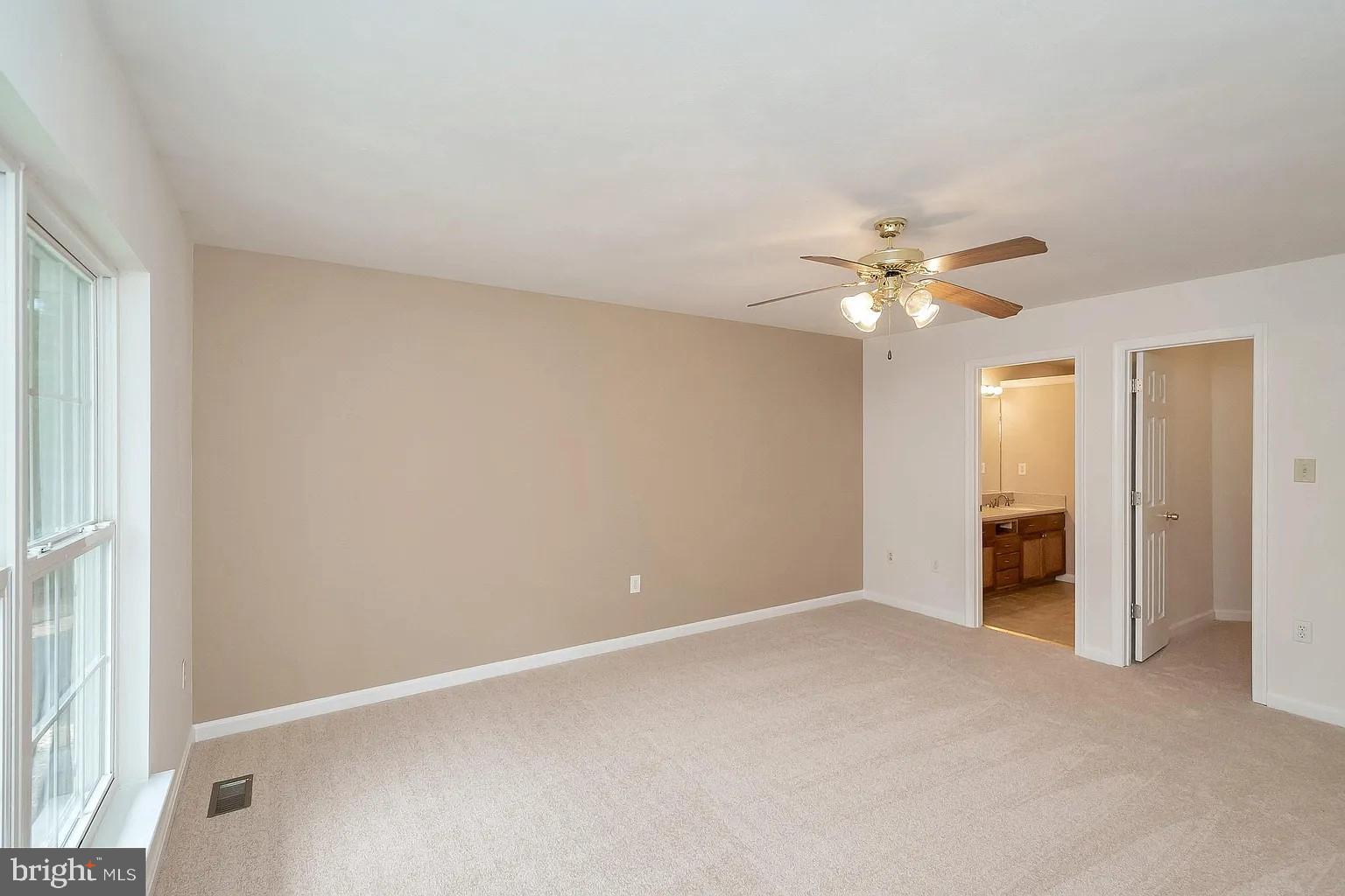 309 Liberty Boulevard Locust Grove, VA 22508 - Photo 10 of 42 a view of an empty room with a chandelier fan