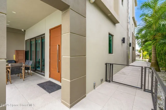 a view of a balcony with wooden floor and outdoor space