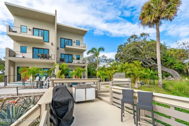 a view of a hallway with furniture and entryway