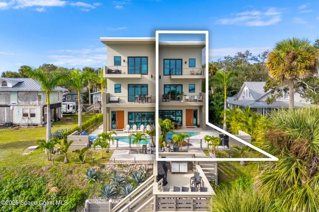 a outdoor space with patio couches and a potted plant