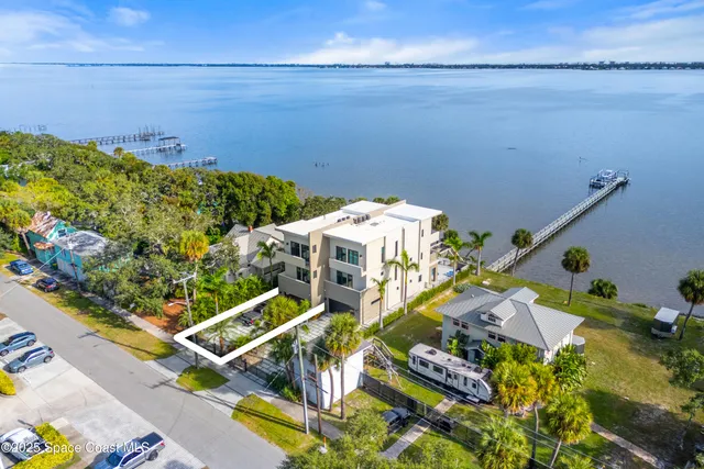 a view of a swimming pool with a table and chairs