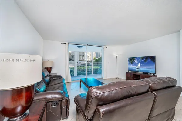 a living room with furniture and a window