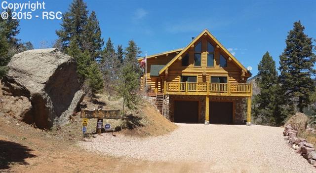 5550 Timpa Road Cascade, CO 80809 - Photo 2 of 3 Wide driveway * Rock formation on the property