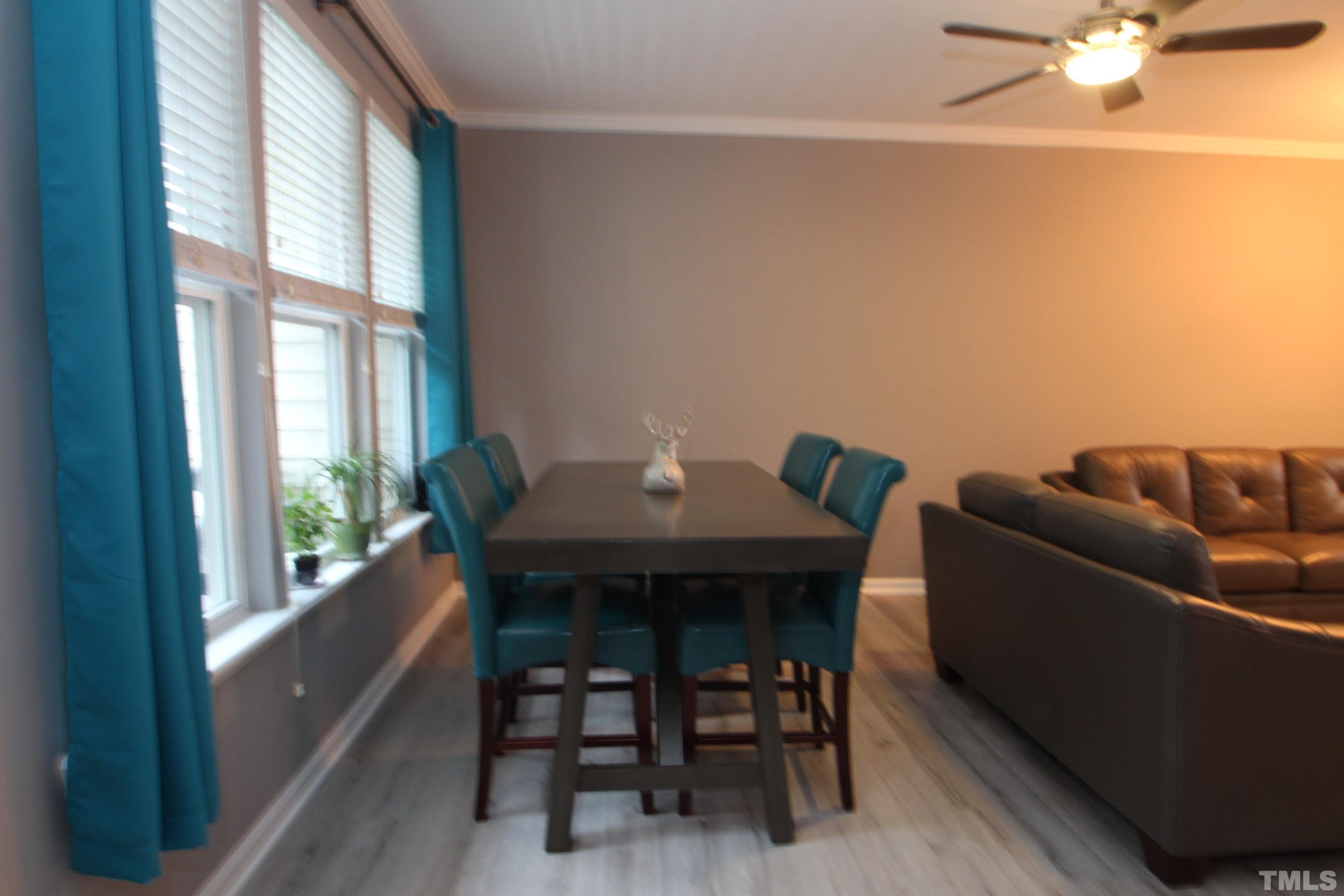 5804 Cameo Glass Way Raleigh, NC 27612 - Photo 13 of 25 a view of a dining room with furniture window and outside view