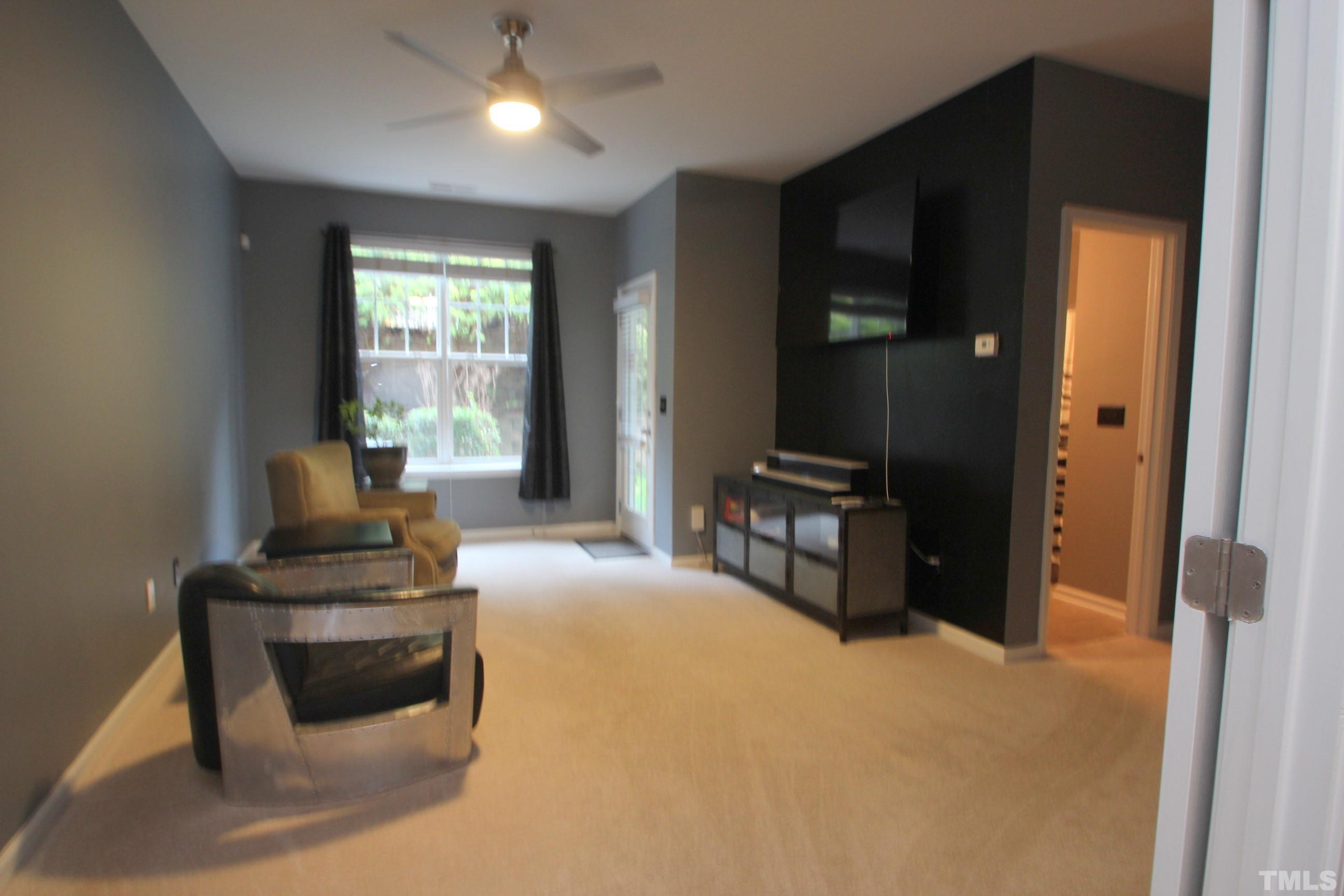 5804 Cameo Glass Way Raleigh, NC 27612 - Photo 14 of 25 a living room with furniture and a large window