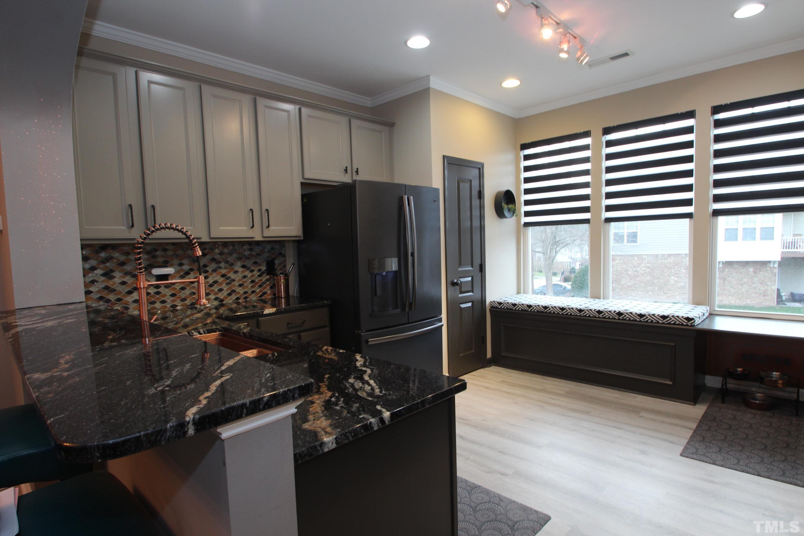 5804 Cameo Glass Way Raleigh, NC 27612 - Photo 3 of 25 a kitchen with a sink appliances and cabinets
