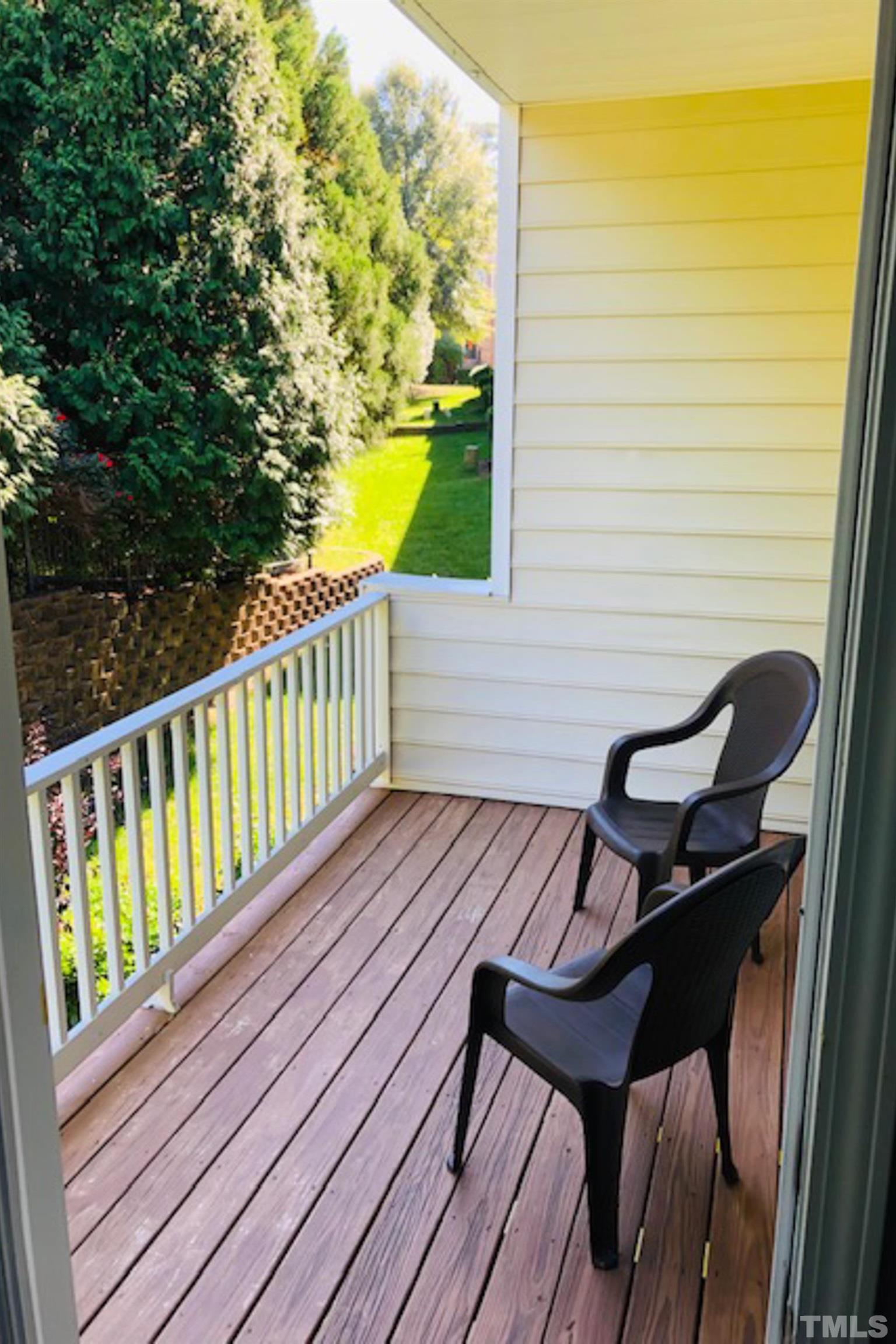 5804 Cameo Glass Way Raleigh, NC 27612 - Photo 25 of 25 a view of a roof deck with wooden floor and seating space