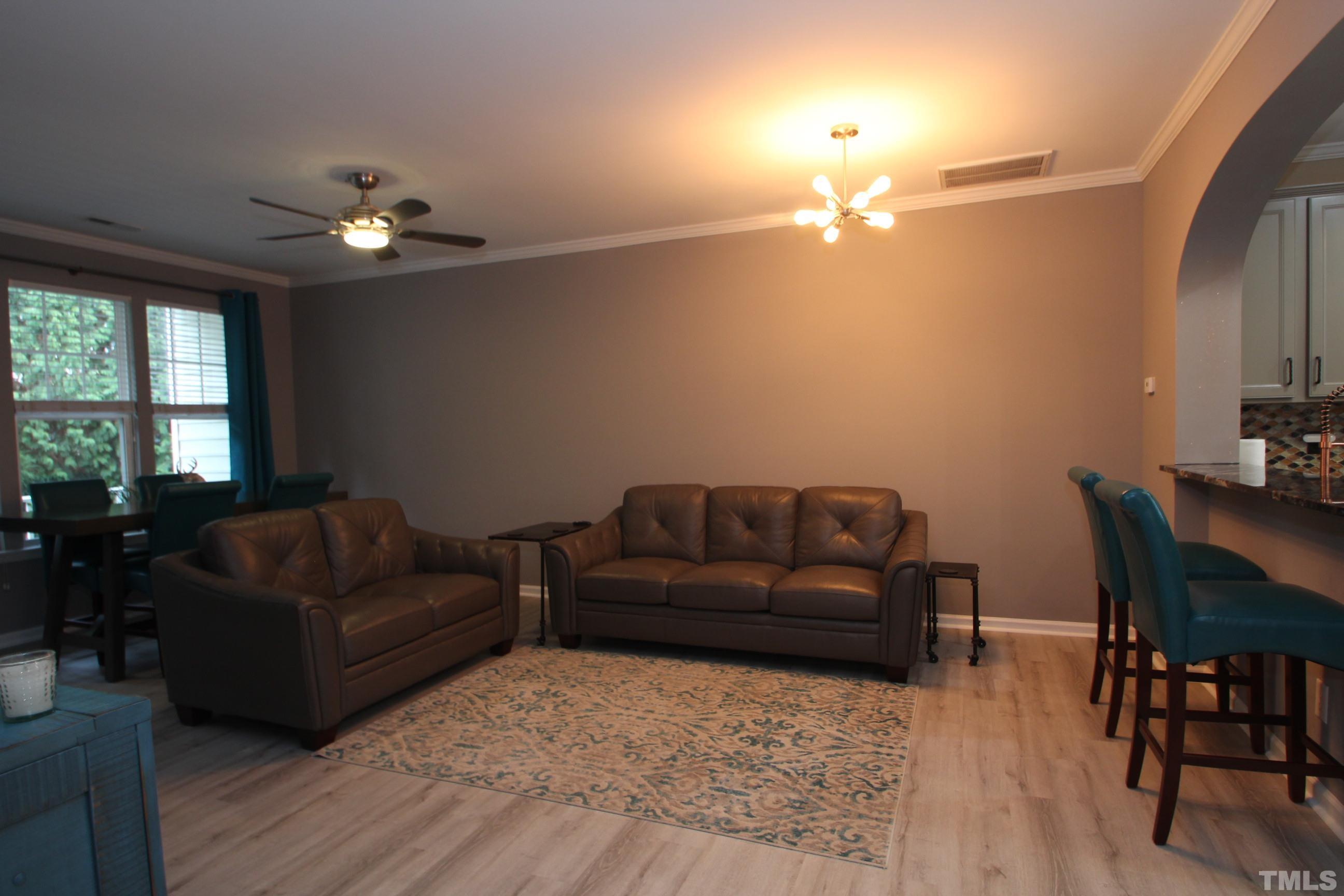 5804 Cameo Glass Way Raleigh, NC 27612 - Photo 6 of 25 a living room with furniture flowerpot and window