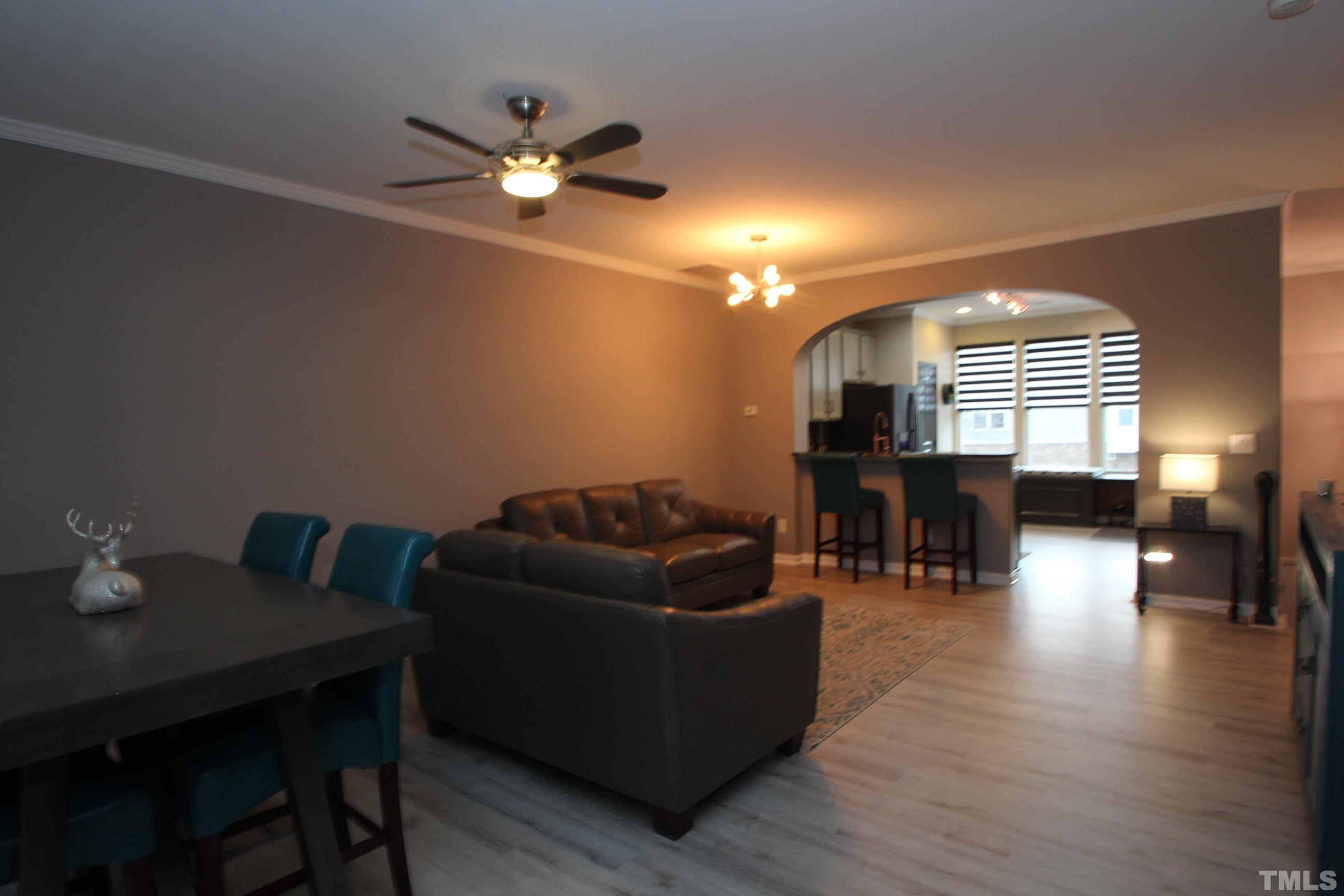 5804 Cameo Glass Way Raleigh, NC 27612 - Photo 7 of 25 a living room with furniture and wooden floor