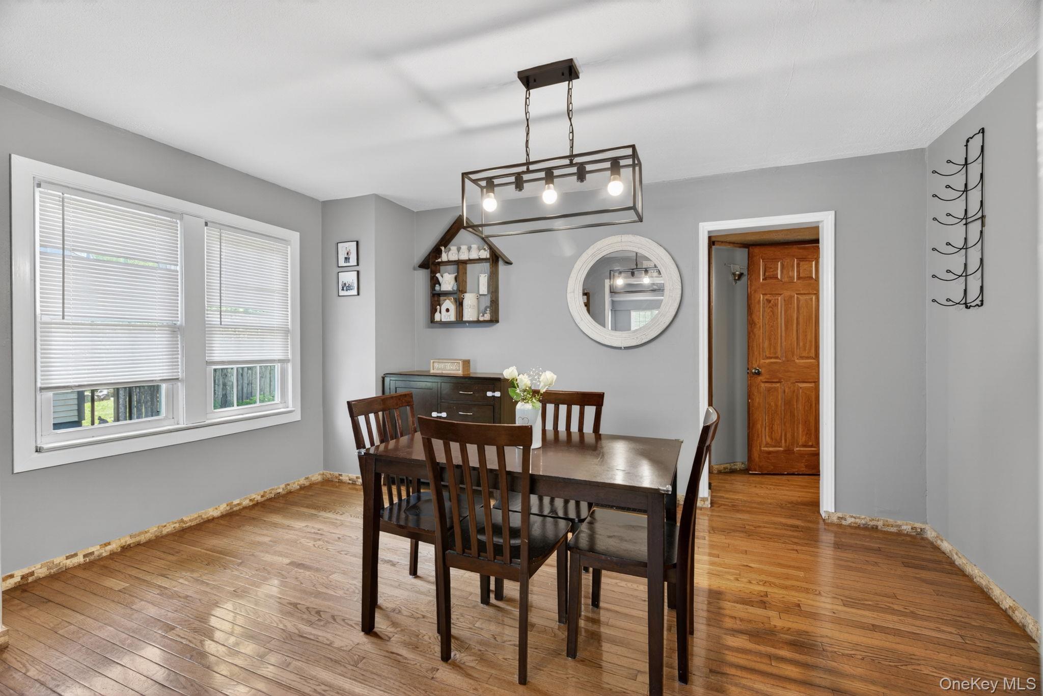 7 Walnut Street Poughkeepsie, NY 12601 - Photo 10 of 30 The dining room offers a warm and inviting space for both everyday meals and special gatherings. Beautiful hardwood floors add timeless elegance and character, while the generous layout provides plenty of room for a large dining table and additional furnishings.