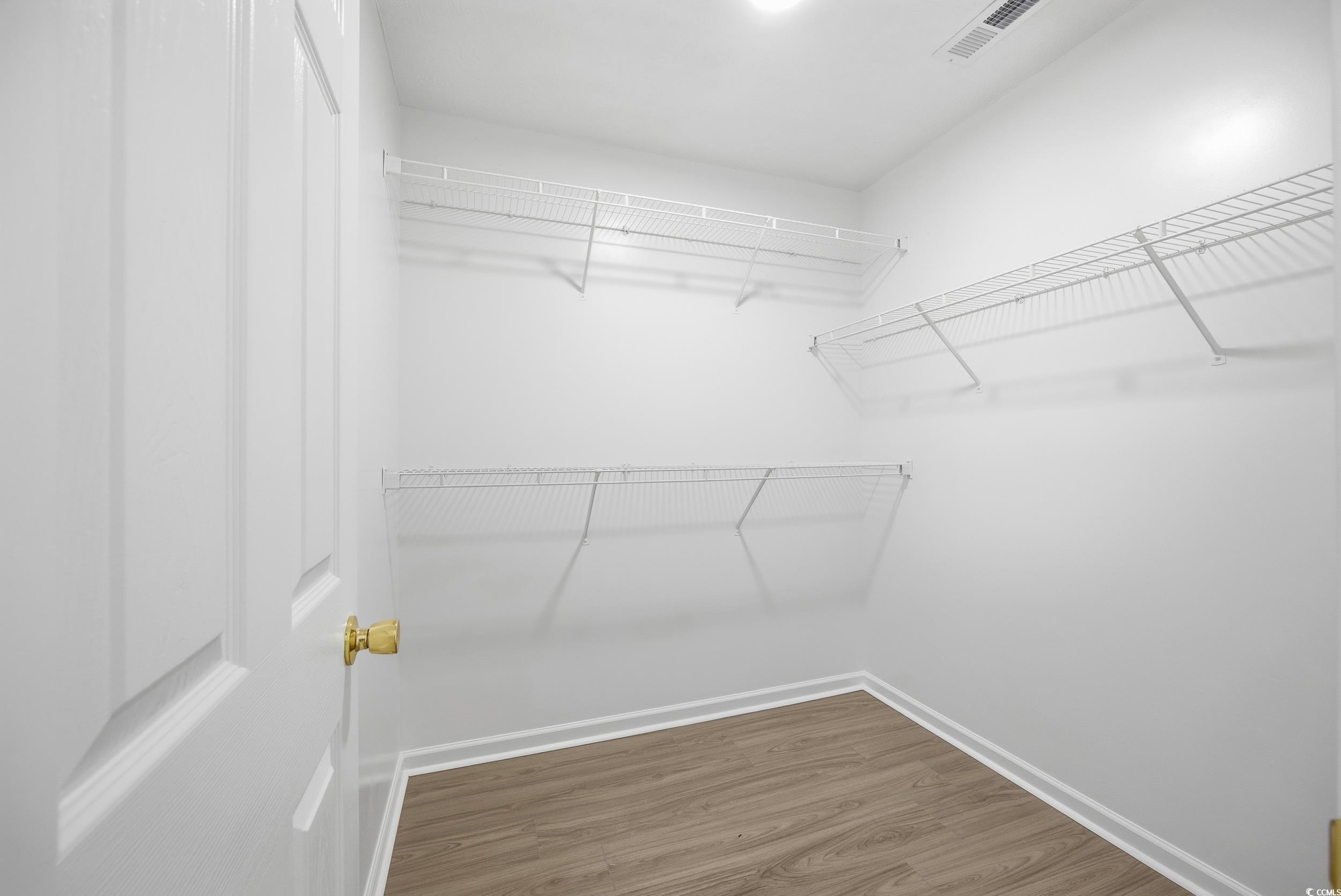 638 Hatteras River Road Myrtle Beach, SC 29588 - Photo 15 of 33 Unfurnished dining area with light wood-style floors and a chandelier