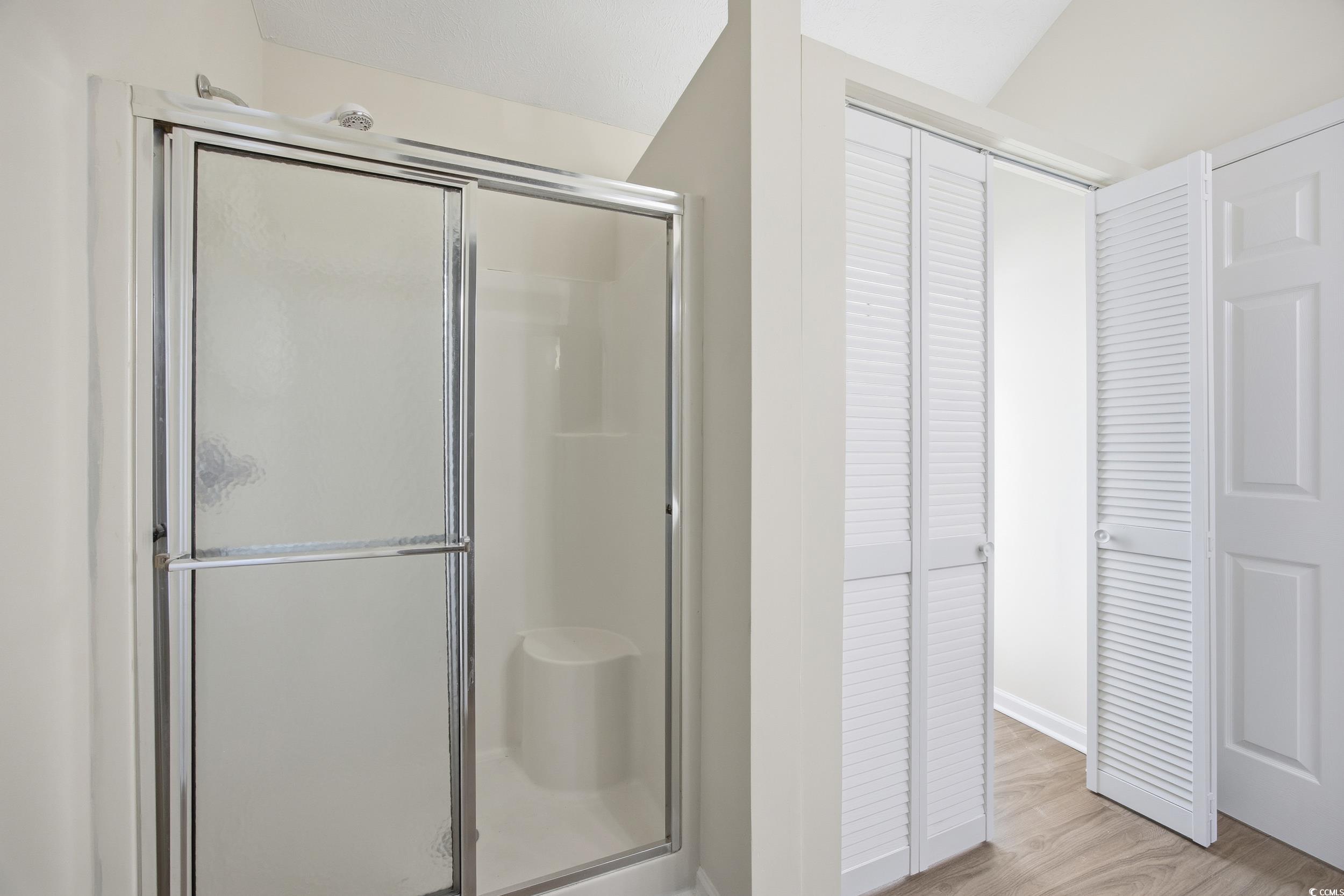 638 Hatteras River Road Myrtle Beach, SC 29588 - Photo 16 of 33 Unfurnished room featuring a tray ceiling, wood finished floors, and a ceiling fan