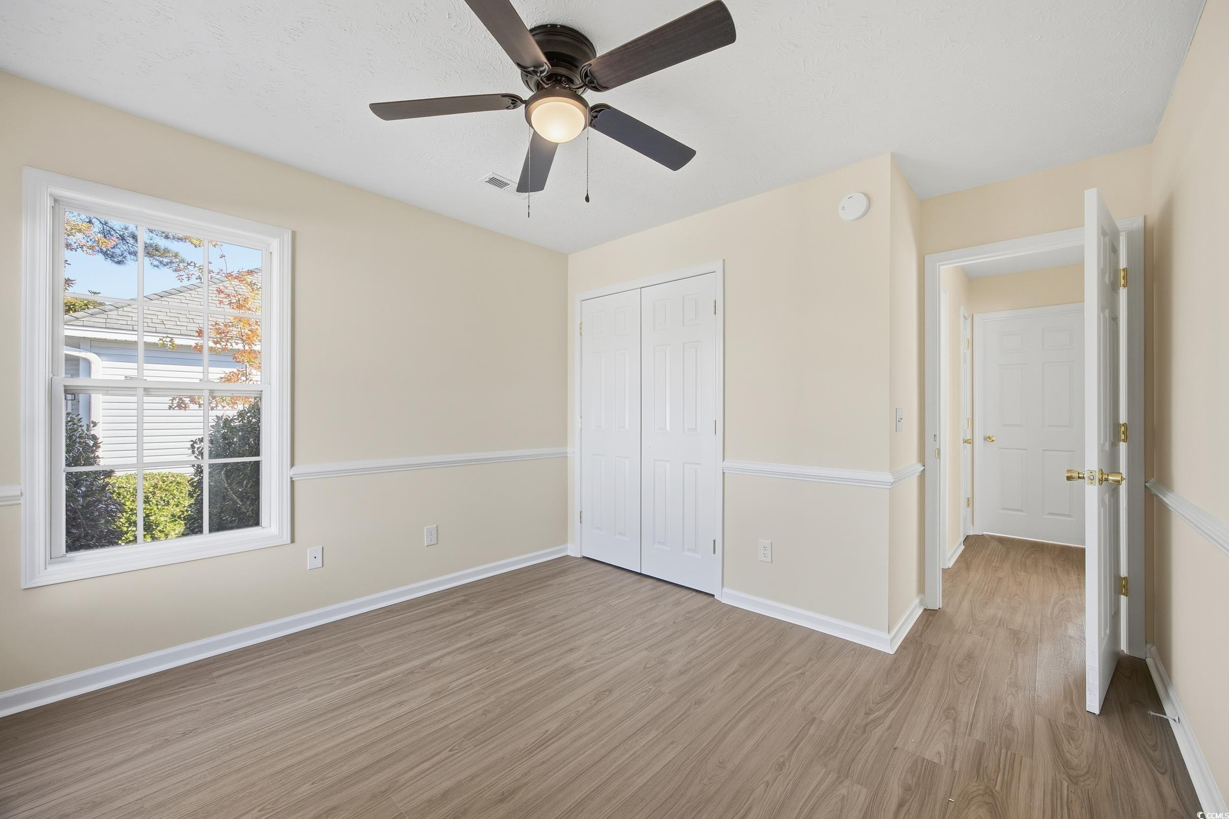 638 Hatteras River Road Myrtle Beach, SC 29588 - Photo 18 of 33 Full bathroom with double vanity, light wood-style flooring, and a shower stall