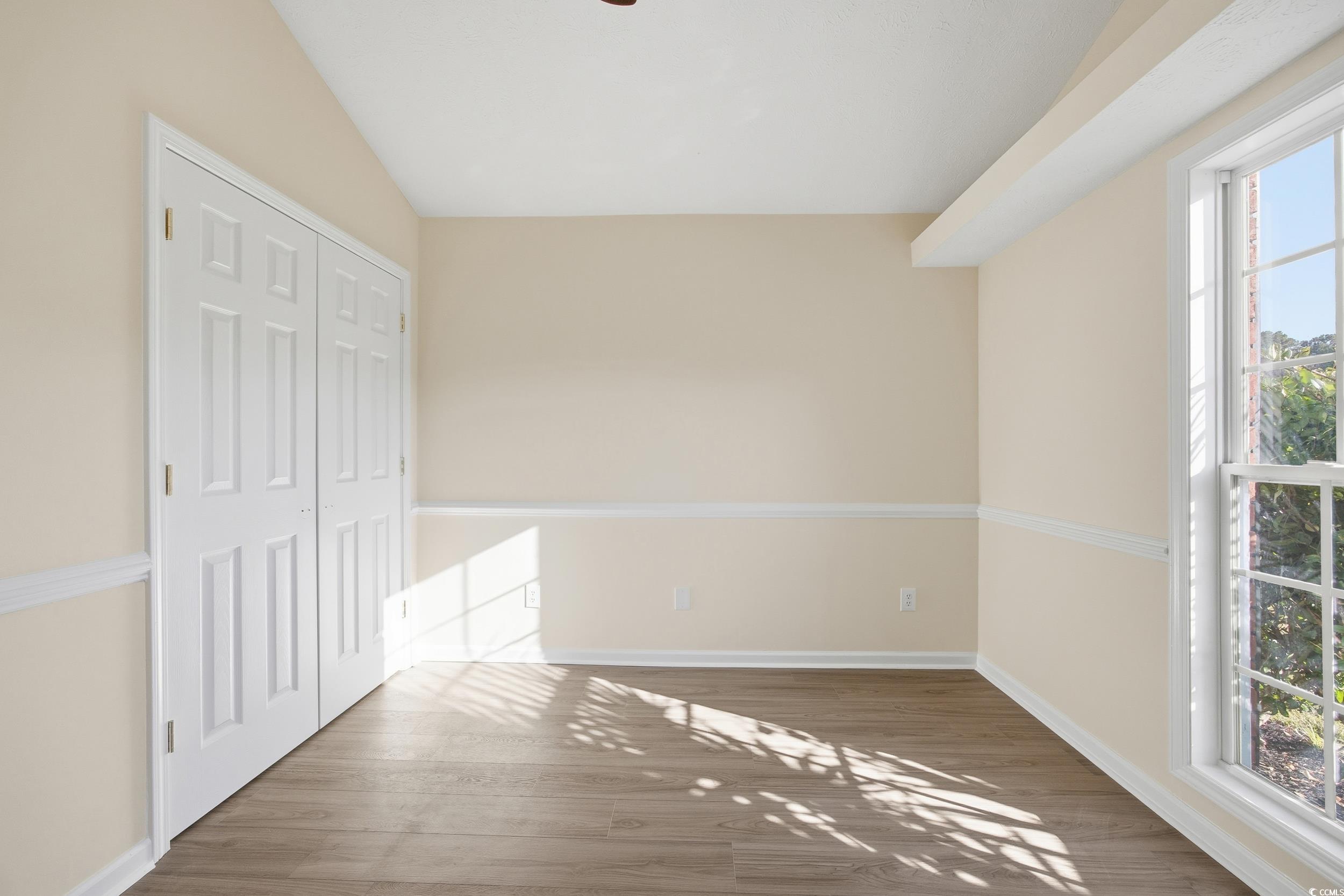 638 Hatteras River Road Myrtle Beach, SC 29588 - Photo 22 of 33 Unfurnished bedroom with wood finished floors, a ceiling fan, and a closet