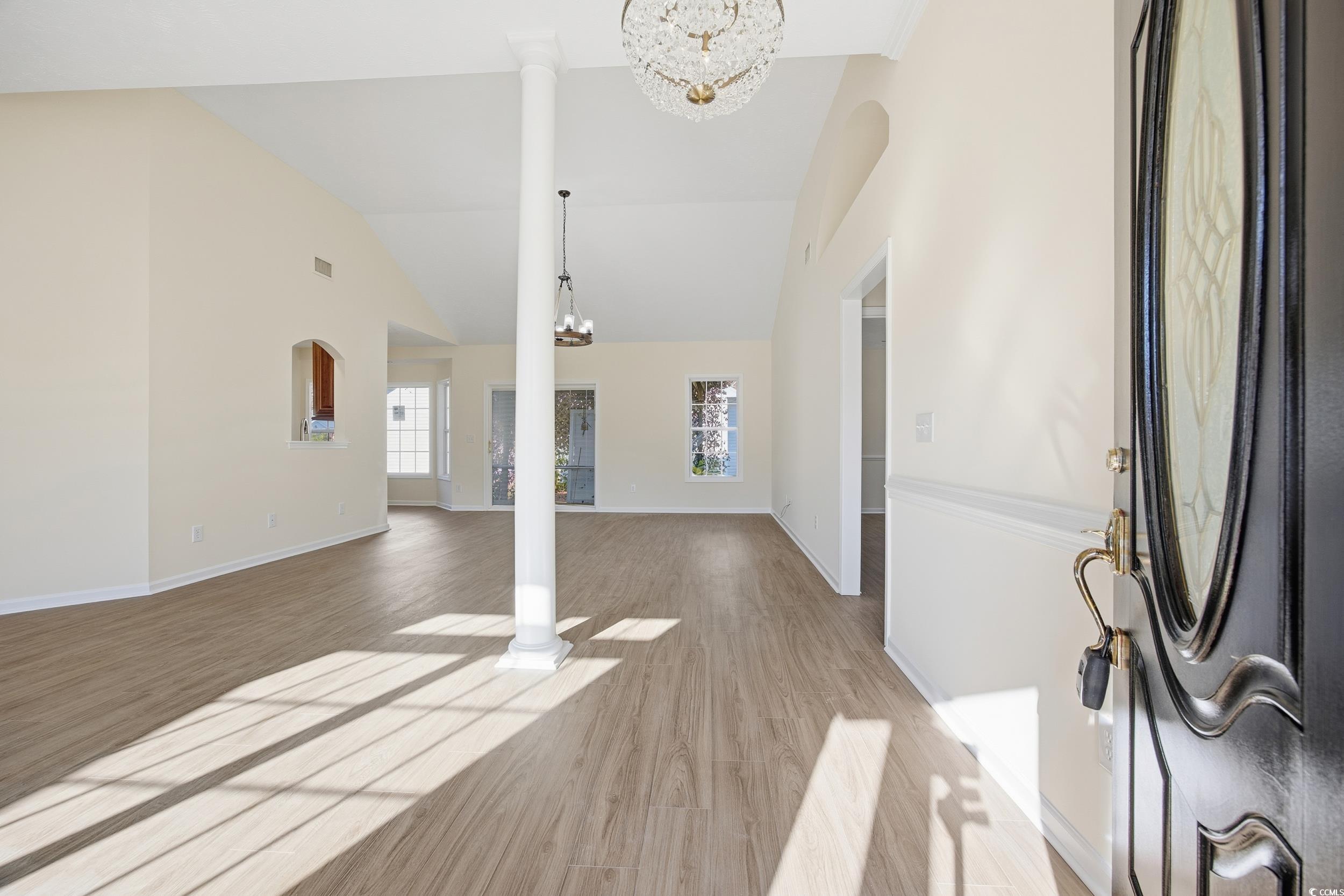 638 Hatteras River Road Myrtle Beach, SC 29588 - Photo 5 of 33 Foyer featuring a chandelier, light wood finished floors, and high vaulted ceiling