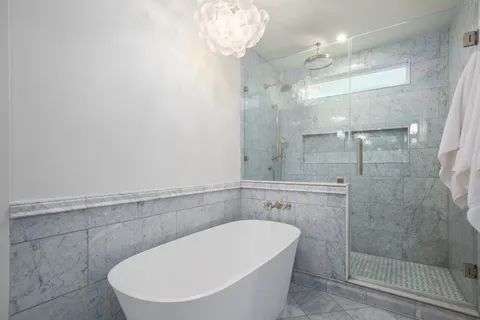 a bathroom with a toilet and a mirror