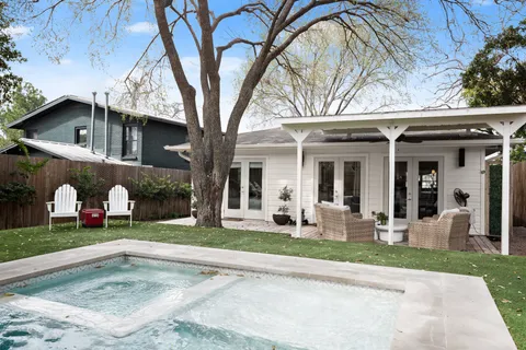 a view of a kitchen with a sink and cabinets