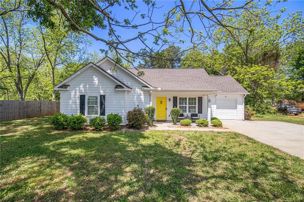 a house that has tree in front of it