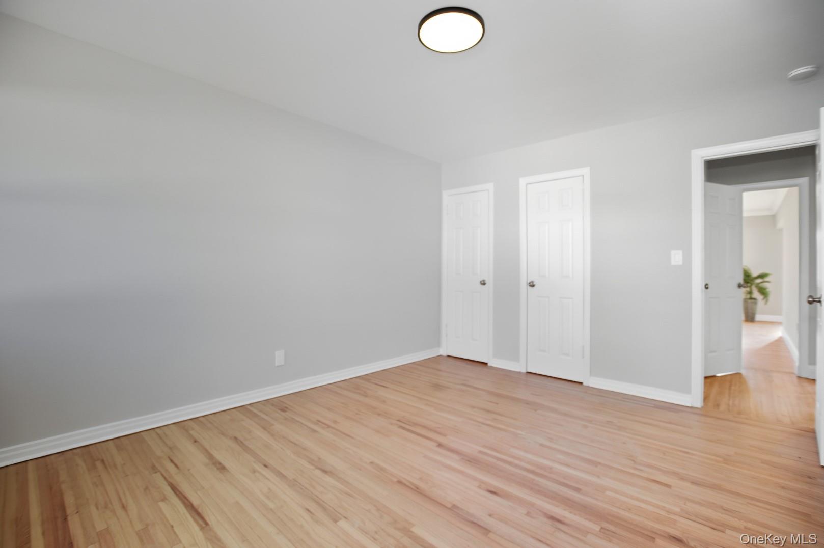 57 Remson Street Valley Stream, NY 11580 - Photo 12 of 27 Bedroom on main level with refinished hardwood floors