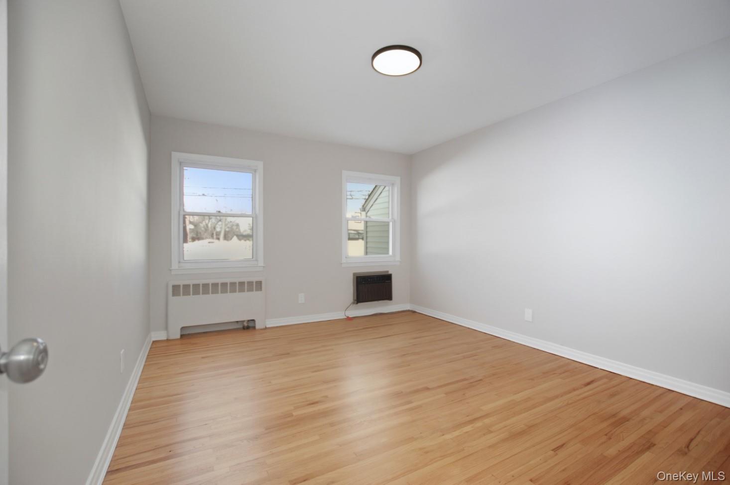 57 Remson Street Valley Stream, NY 11580 - Photo 13 of 27 Bedroom on main level with refinished hardwood floors