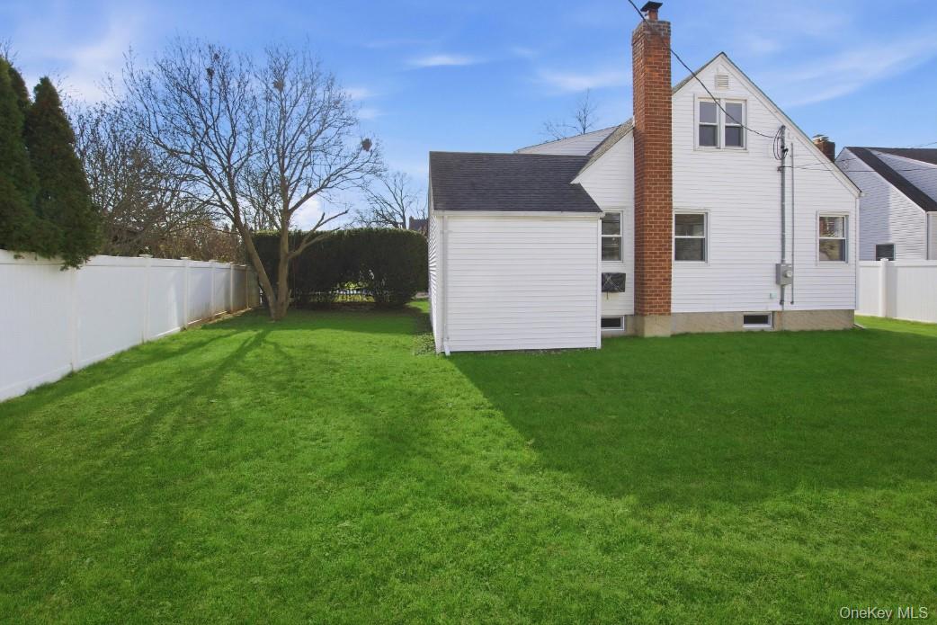 57 Remson Street Valley Stream, NY 11580 - Photo 2 of 27 Rear view of house with a private backyard